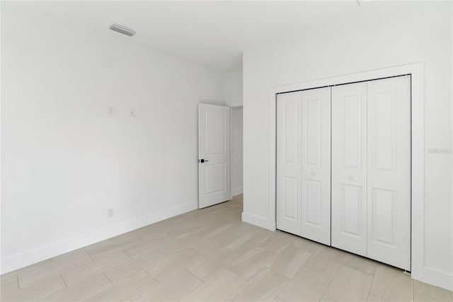 2638 Hagerick Ln, North Port, FL 34288 - unfurnished bedroom with baseboards and a closet
