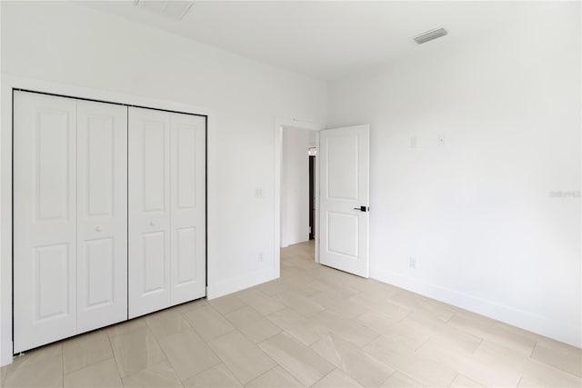 2638 Hagerick Ln, North Port, FL 34288 - unfurnished bedroom featuring baseboards and a closet