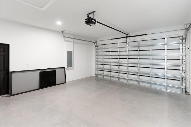 2638 Hagerick Ln, North Port, FL 34288 - garage with electric panel, a garage door opener, and recessed lighting