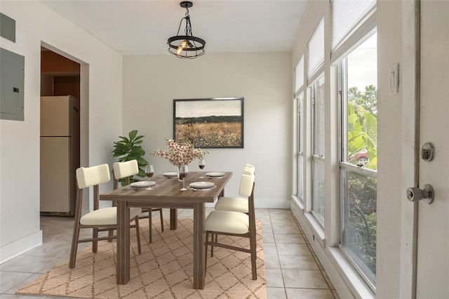 4475 Sandner Dr, Sarasota, FL 34243 - dining room featuring light tile patterned flooring, baseboards, and electric panel