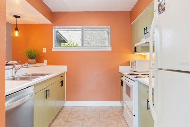 4475 Sandner Dr, Sarasota, FL 34243 - kitchen with white appliances, a sink, under cabinet range hood, and light countertops
