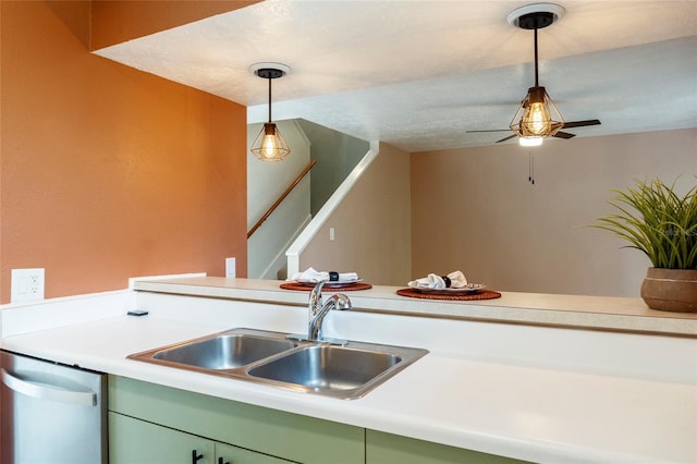 4475 Sandner Dr, Sarasota, FL 34243 - kitchen featuring stainless steel dishwasher, a sink, light countertops, and hanging light fixtures