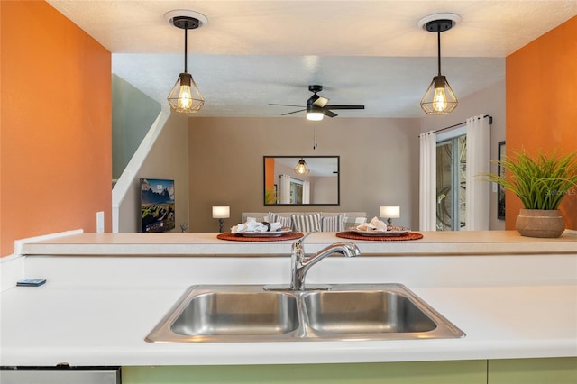 4475 Sandner Dr, Sarasota, FL 34243 - kitchen featuring a sink, open floor plan, ceiling fan, and hanging light fixtures