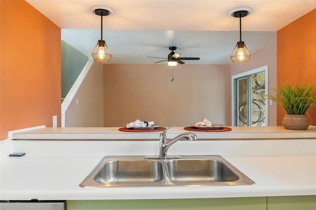 4475 Sandner Dr, Sarasota, FL 34243 - kitchen with a sink, ceiling fan, pendant lighting, and light countertops