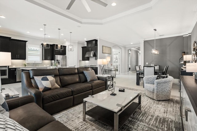 12856 Sorrento Way, Bradenton, FL 34211 - living room with a ceiling fan, a raised ceiling, recessed lighting, ornamental molding, and arched walkways