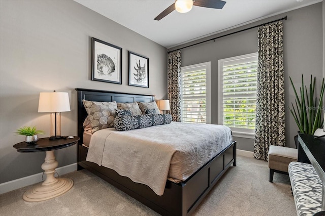 12856 Sorrento Way, Bradenton, FL 34211 - bedroom featuring light colored carpet, baseboards, multiple windows, and ceiling fan