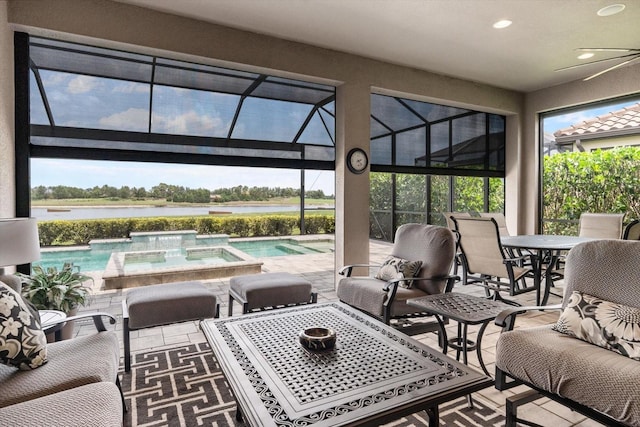 12856 Sorrento Way, Bradenton, FL 34211 - view of patio with outdoor dining area, a pool with connected hot tub, a water view, glass enclosure, and a ceiling fan