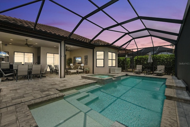 12856 Sorrento Way, Bradenton, FL 34211 - view of swimming pool with ceiling fan, a patio, outdoor dining space, a pool with connected hot tub, and glass enclosure