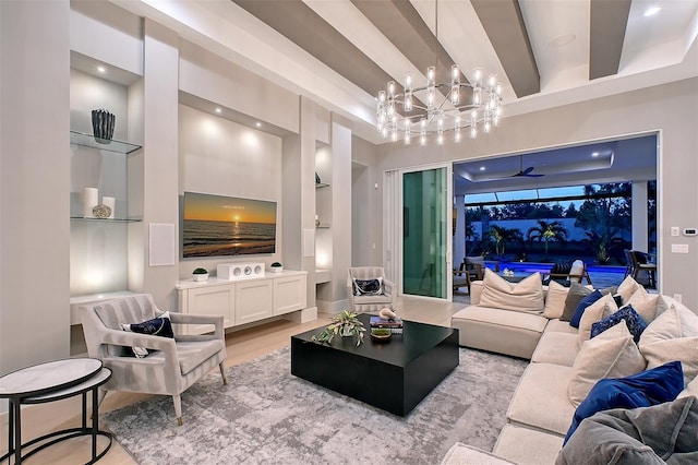 7838 Bowspirit Way, Lakewood Ranch, FL 34202 - living area featuring built in shelves, a chandelier, wood finished floors, and recessed lighting