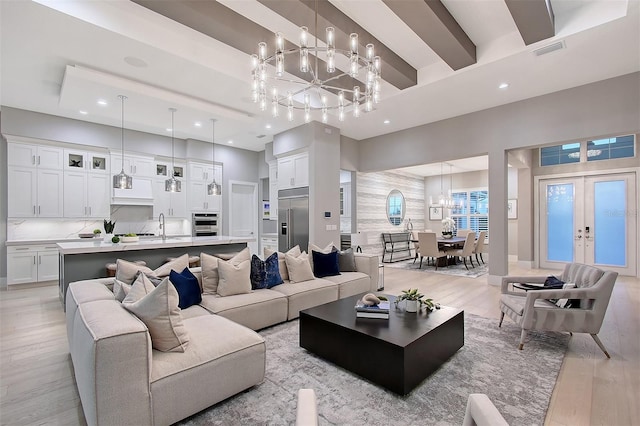 7838 Bowspirit Way, Lakewood Ranch, FL 34202 - living area with a chandelier, light wood finished floors, recessed lighting, and french doors