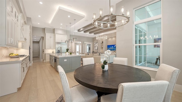 7838 Bowspirit Way, Lakewood Ranch, FL 34202 - dining space with a chandelier, light wood-style flooring, and recessed lighting