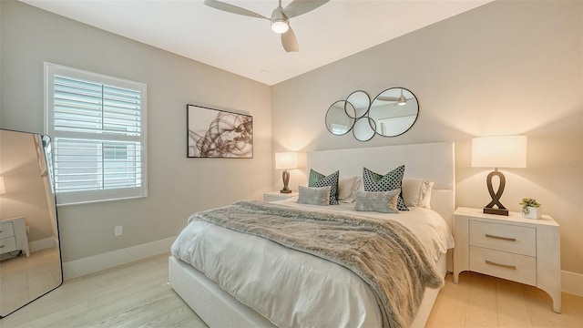 7838 Bowspirit Way, Lakewood Ranch, FL 34202 - bedroom with light wood-style flooring, baseboards, and ceiling fan