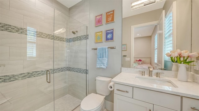 7838 Bowspirit Way, Lakewood Ranch, FL 34202 - bathroom featuring toilet, a shower stall, vanity, and ensuite bathroom