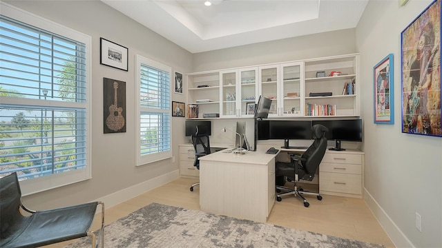7838 Bowspirit Way, Lakewood Ranch, FL 34202 - office space with baseboards, light wood-type flooring, and a tray ceiling
