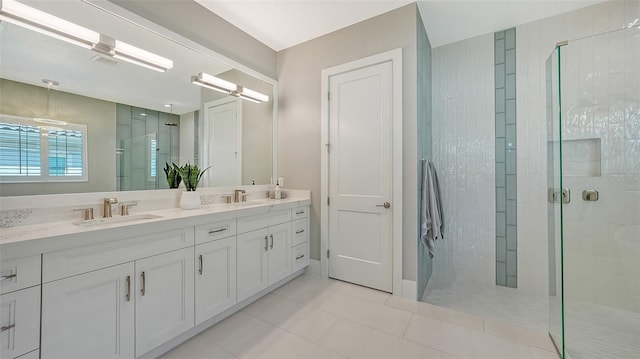 7838 Bowspirit Way, Lakewood Ranch, FL 34202 - bathroom featuring a stall shower, double vanity, and tile patterned floors