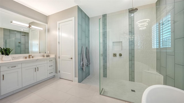 7838 Bowspirit Way, Lakewood Ranch, FL 34202 - bathroom with a shower stall, vanity, tile patterned floors, and a soaking tub