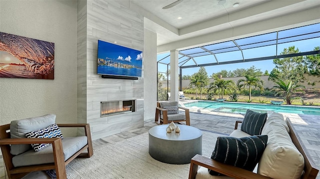 7838 Bowspirit Way, Lakewood Ranch, FL 34202 - view of patio featuring a fireplace, a ceiling fan, and an outdoor pool