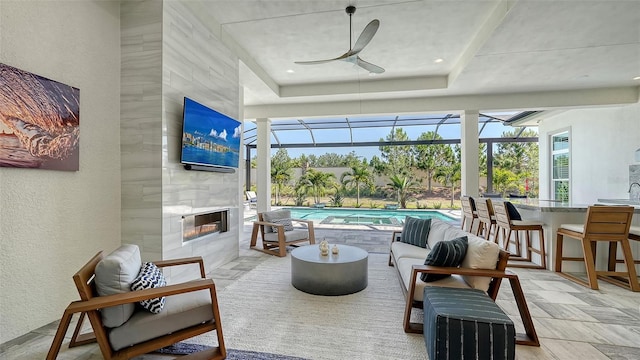 7838 Bowspirit Way, Lakewood Ranch, FL 34202 - sunroom / solarium featuring ceiling fan, an outdoor living space with a fireplace, and a pool