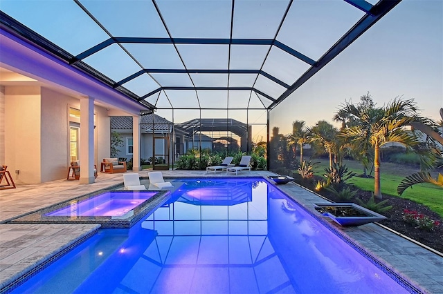7838 Bowspirit Way, Lakewood Ranch, FL 34202 - pool at dusk with a pool with connected hot tub, a patio, and a lanai