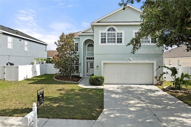 5224 58th Ter E, Bradenton, FL 34203 - view of front of property featuring concrete driveway, stucco siding, a garage, and a gate