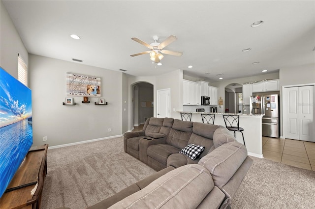 5224 58th Ter E, Bradenton, FL 34203 - living area with arched walkways, light carpet, a ceiling fan, recessed lighting, and baseboards