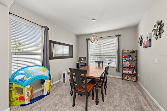 5224 58th Ter E, Bradenton, FL 34203 - dining room with a chandelier, carpet flooring, and baseboards