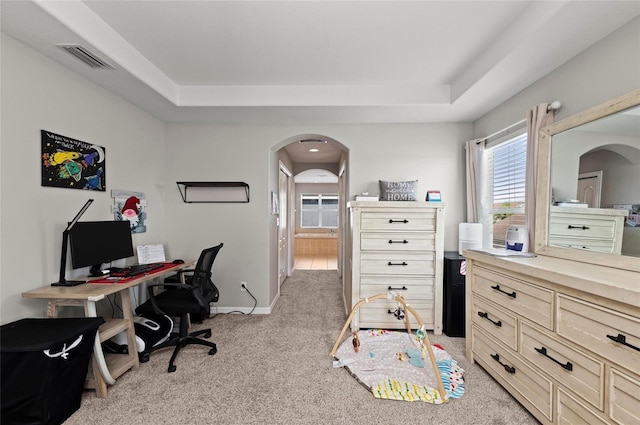 5224 58th Ter E, Bradenton, FL 34203 - office area featuring arched walkways, a raised ceiling, light colored carpet, and baseboards