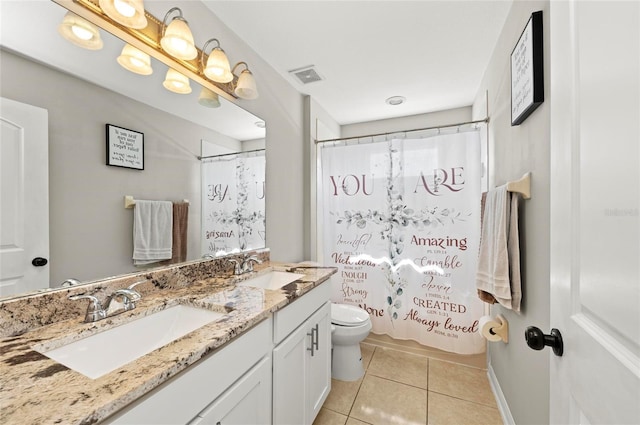 5224 58th Ter E, Bradenton, FL 34203 - bathroom featuring toilet, double vanity, tile patterned floors, and a shower with shower curtain