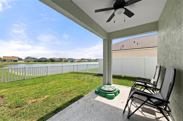 5224 58th Ter E, Bradenton, FL 34203 - view of yard with a water view, a ceiling fan, a patio area, and a residential view