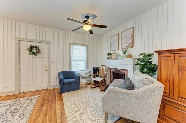2509 8th Ave W, Bradenton, FL 34205 - living room with a brick fireplace, light wood-style floors, and ceiling fan