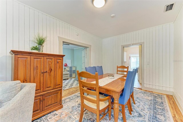 2509 8th Ave W, Bradenton, FL 34205 - dining space featuring light wood-style floors and ornamental molding