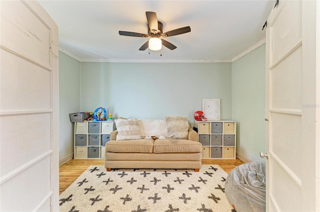 2509 8th Ave W, Bradenton, FL 34205 - living room featuring light wood-style floors, crown molding, ceiling fan, and baseboards
