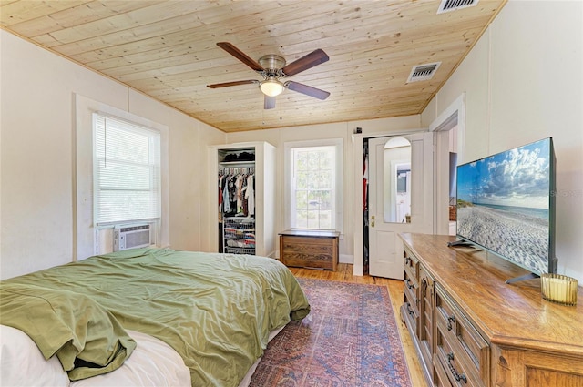 2509 8th Ave W, Bradenton, FL 34205 - bedroom featuring wood ceiling, light wood-style floors, cooling unit, and a ceiling fan