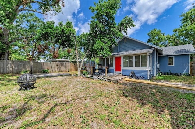 2509 8th Ave W, Bradenton, FL 34205 - view of front of home with a fire pit, a deck, and roof with shingles