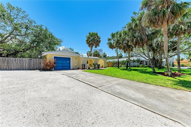 5223 Shadow Lawn Dr, Sarasota, FL 34242 - view of front of property with concrete driveway, a garage, and stucco siding