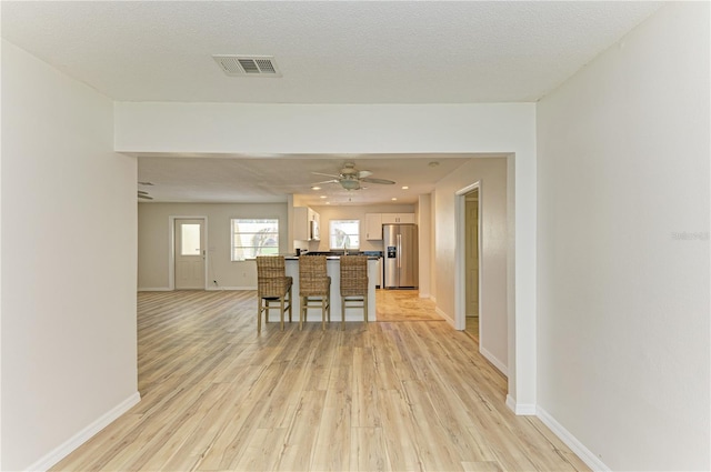 5223 Shadow Lawn Dr, Sarasota, FL 34242 - dining area featuring light wood-style floors, baseboards, and a ceiling fan