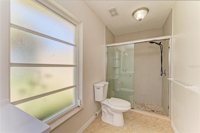 5223 Shadow Lawn Dr, Sarasota, FL 34242 - bathroom featuring toilet, a shower stall, baseboards, plenty of natural light, and a textured ceiling