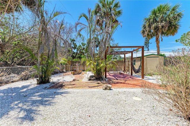 5223 Shadow Lawn Dr, Sarasota, FL 34242 - fenced backyard featuring a patio area