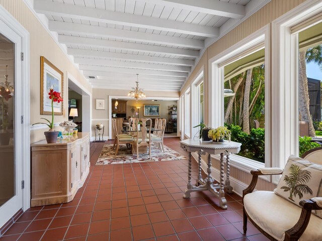 7614 Peninsular Dr, Sarasota, FL 34231 - sunroom / solarium featuring a chandelier and beamed ceiling