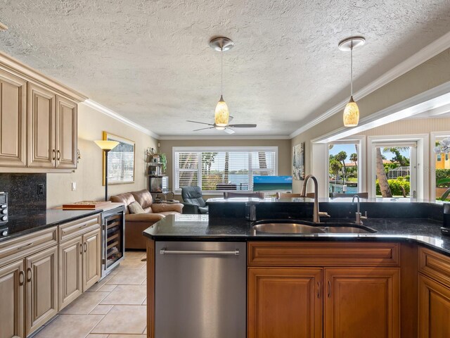 7614 Peninsular Dr, Sarasota, FL 34231 - kitchen with stainless steel dishwasher, a sink, ceiling fan, beverage cooler, and decorative light fixtures