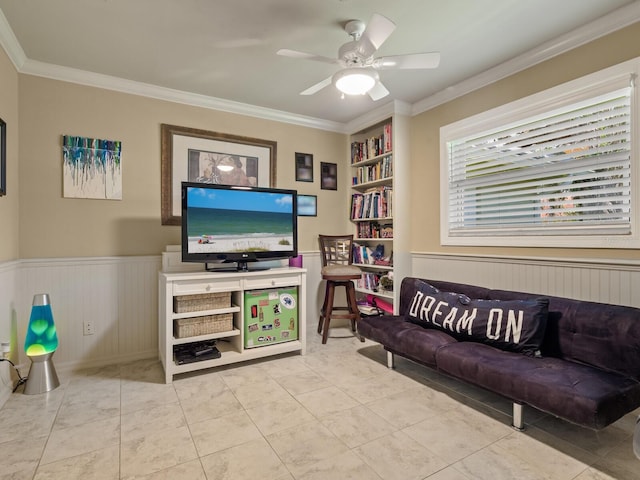7614 Peninsular Dr, Sarasota, FL 34231 - tiled living room featuring ornamental molding, a wainscoted wall, and ceiling fan