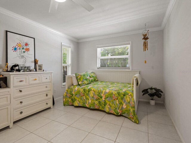 7614 Peninsular Dr, Sarasota, FL 34231 - bedroom with light tile patterned floors, ornamental molding, baseboards, and ceiling fan