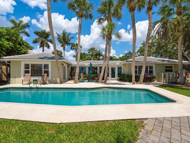 7614 Peninsular Dr, Sarasota, FL 34231 - swimming pool featuring a patio
