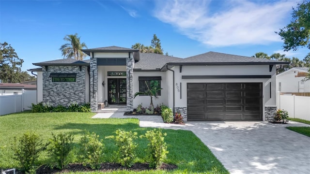 805 Padua Ct, Nokomis, FL 34275 - prairie-style home featuring an attached garage, stone siding, stucco siding, decorative driveway, and french doors