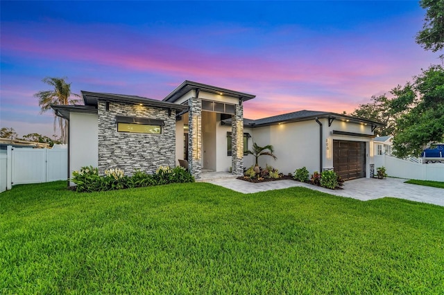 805 Padua Ct, Nokomis, FL 34275 - view of front of house featuring a garage, stone siding, decorative driveway, and stucco siding