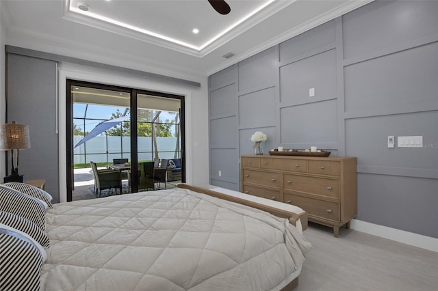 805 Padua Ct, Nokomis, FL 34275 - bedroom featuring access to outside, crown molding, baseboards, recessed lighting, and a tray ceiling