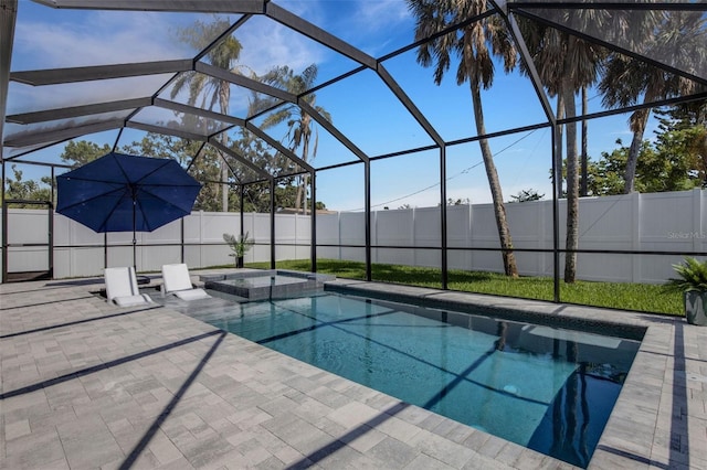 805 Padua Ct, Nokomis, FL 34275 - view of pool featuring a patio area, a fenced backyard, glass enclosure, and a pool with connected hot tub