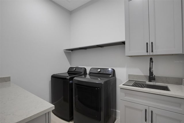805 Padua Ct, Nokomis, FL 34275 - laundry area with washing machine and dryer and cabinet space