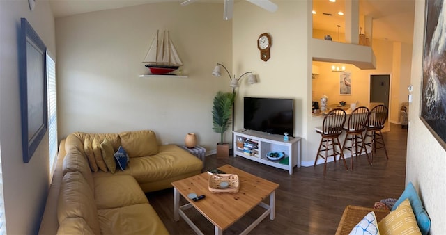 600 Mirabella Cir Unit 201, Venice, FL 34292 - living room with wood finished floors, baseboards, ceiling fan, and a towering ceiling