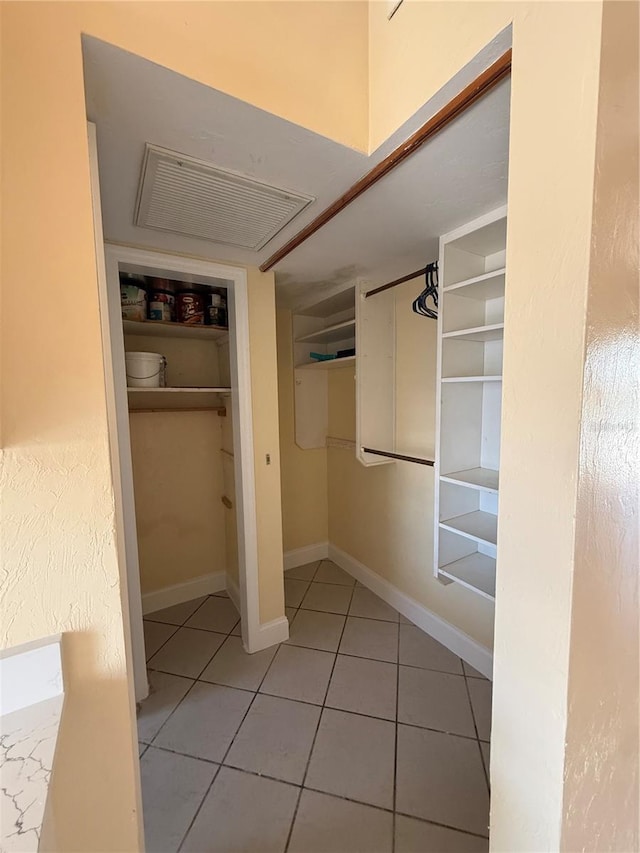 6006 Midnight Pass Rd Unit 48, Sarasota, FL 34242 - spacious closet featuring tile patterned flooring